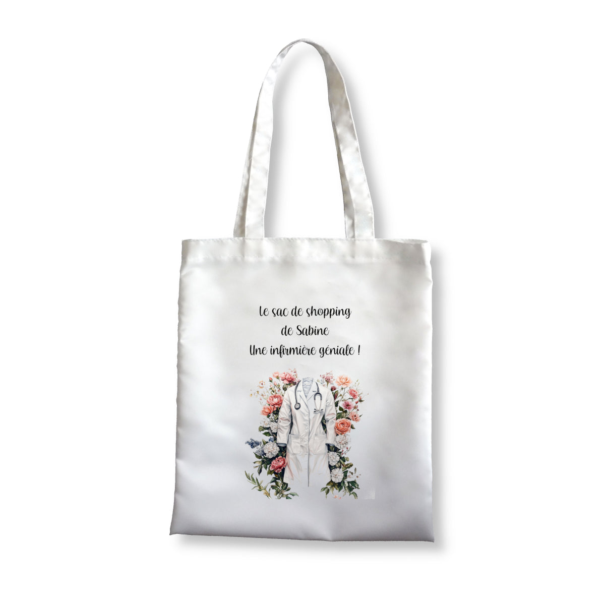 Totebag blanc avec un motif représentant une blouse d'infirmière et un décor fleurit