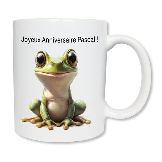 Mug blanc en céramique avec un dessin représentant une grenouille verte de face qui sourit