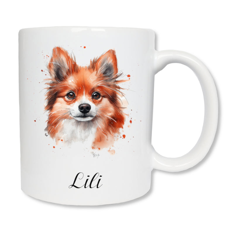 Mug blanc en céramique de 325 ml avec un dessin représentant la tête de face d'un chien spitz roux et personnalisé avec un prénom.