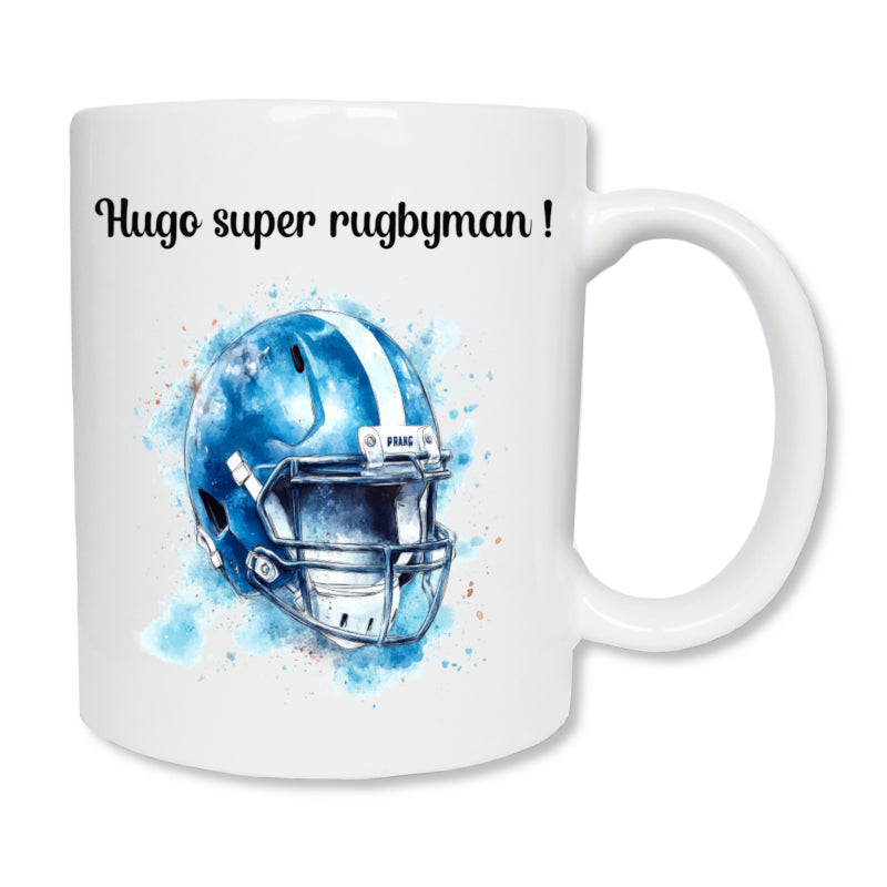 Mug blanc en céramique  de 325 ml avec le dessin d'un casque bleu de rugby, et personnalisé avec un message. Un cadeau pour sportif rugbyman.